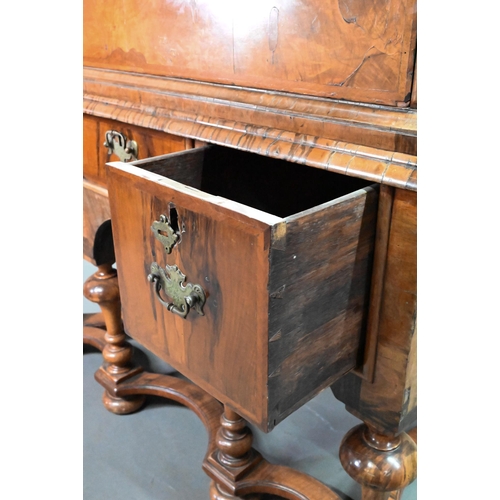 916 - A George III feather-banded walnut chest on stand, composed of two short over three long graduated d... 