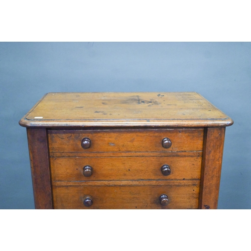 919 - A Victorian mahogany Wellington chest of seven graduated drawers, with turned handles, raised on a p... 