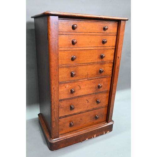 919 - A Victorian mahogany Wellington chest of seven graduated drawers, with turned handles, raised on a p... 