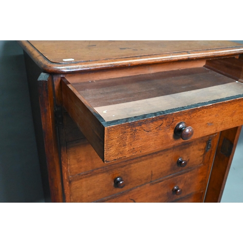 919 - A Victorian mahogany Wellington chest of seven graduated drawers, with turned handles, raised on a p... 