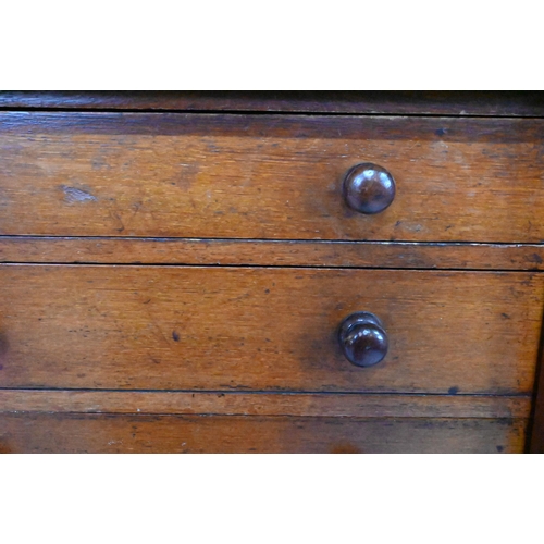 919 - A Victorian mahogany Wellington chest of seven graduated drawers, with turned handles, raised on a p... 