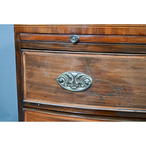 928 - A Victorian mahogany bow-fronted chest of three drawers beneath a full width slide, raised on shaped... 