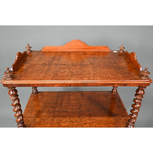 930 - A Victorian walnut three tier what-not with barley twist supports, over a base drawer, on brass cast... 