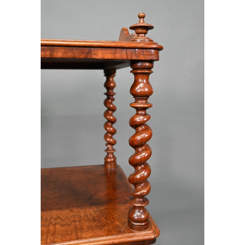 930 - A Victorian walnut three tier what-not with barley twist supports, over a base drawer, on brass cast... 