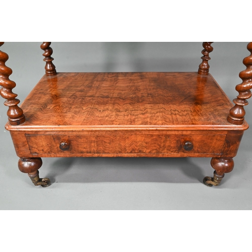 930 - A Victorian walnut three tier what-not with barley twist supports, over a base drawer, on brass cast... 