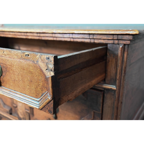 933 - A Jacobean oak chest of four long irregularly graduated drawers, with applied geometric mouldings an... 