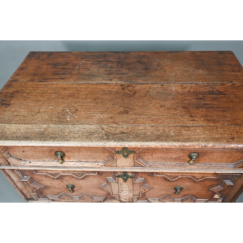 933 - A Jacobean oak chest of four long irregularly graduated drawers, with applied geometric mouldings an... 