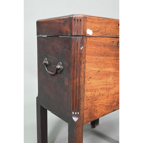 943 - A small Georgian mahogany cellarette, the canted reeded corners to square legs, on castors, carrying... 