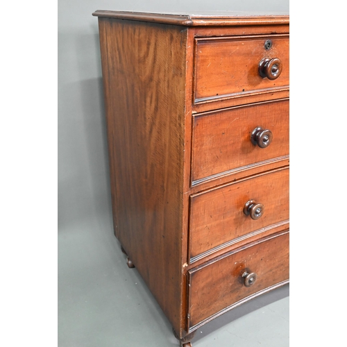 944 - A Georgian mahogany concave chest of two short over three long graduated drawers, with turned handle... 