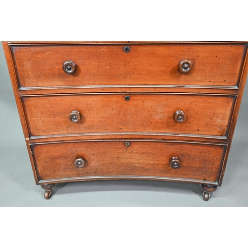 944 - A Georgian mahogany concave chest of two short over three long graduated drawers, with turned handle... 