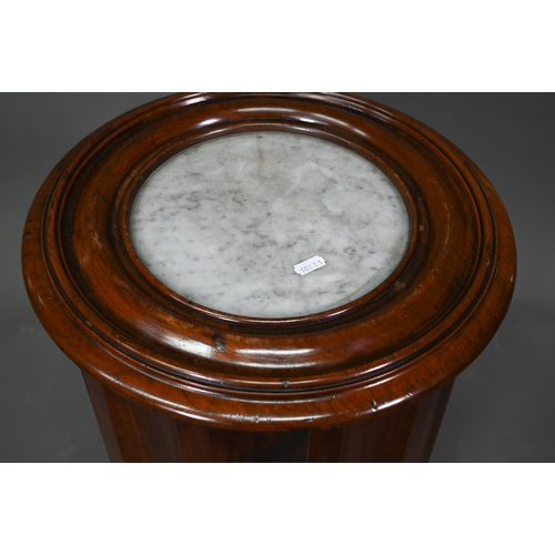 949 - A Victorian marble top mahogany cylinder pot cupboard, the fluted sides and door raised on an octago... 