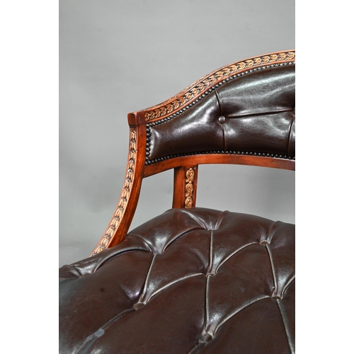 950 - Theodore Alexander, a part gilt decorated neo-classical style buttoned brown leather chair