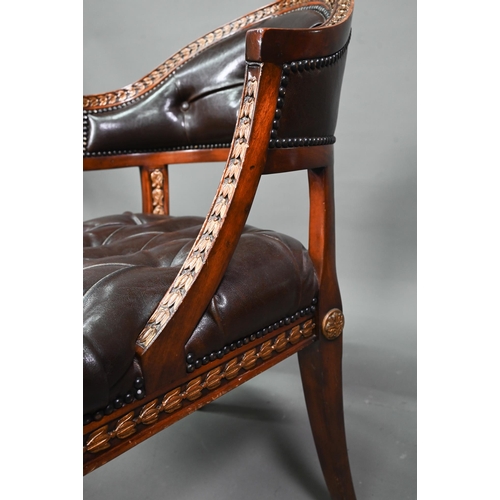 950 - Theodore Alexander, a part gilt decorated neo-classical style buttoned brown leather chair