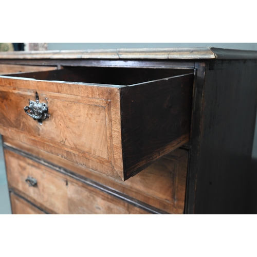 953 - An 18th century cross-banded walnut chest of two short over three long graduated drawers, raised on ... 