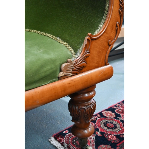 954 - A late Victorian walnut framed single scroll end chaise, upholstered in green dralon, raised on turn... 