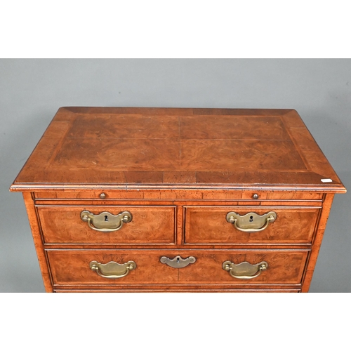 961 - A good reproduction George II style feather-banded chest of drawers, the full width brush slide over... 