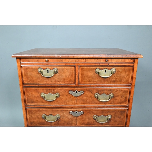 961 - A good reproduction George II style feather-banded chest of drawers, the full width brush slide over... 