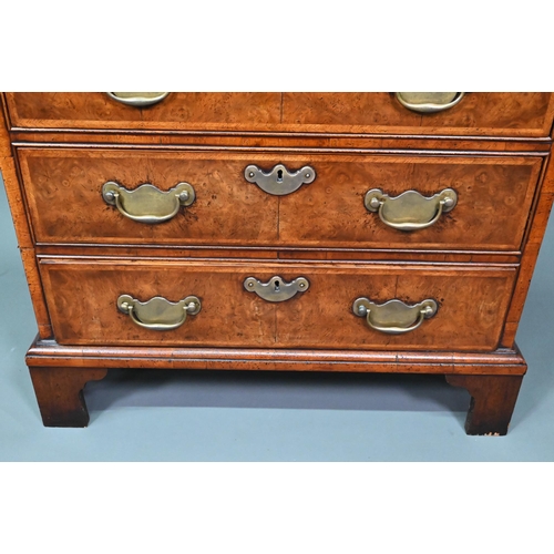 961 - A good reproduction George II style feather-banded chest of drawers, the full width brush slide over... 