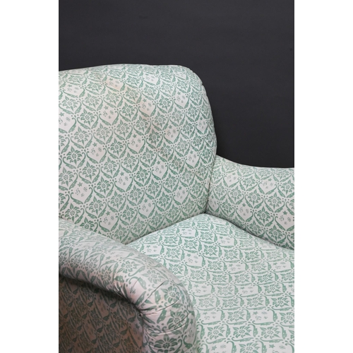 962 - An early 20th century easy armchair by Howard, in original green monogramed ticking, raised on squar... 