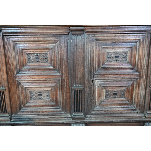 965 - A 17th century jointed oak cupboard, with two moulded panelled doors over a full width drawer, raise... 