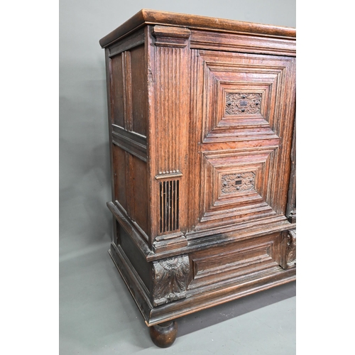 965 - A 17th century jointed oak cupboard, with two moulded panelled doors over a full width drawer, raise... 