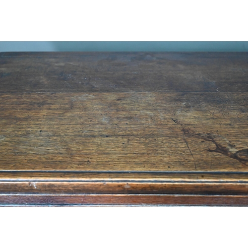 965 - A 17th century jointed oak cupboard, with two moulded panelled doors over a full width drawer, raise... 