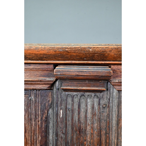 965 - A 17th century jointed oak cupboard, with two moulded panelled doors over a full width drawer, raise... 