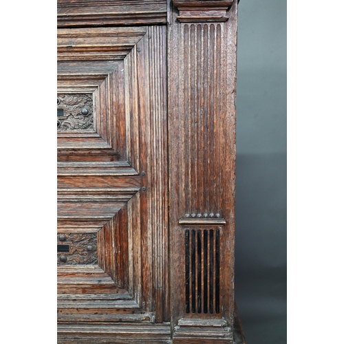 965 - A 17th century jointed oak cupboard, with two moulded panelled doors over a full width drawer, raise... 