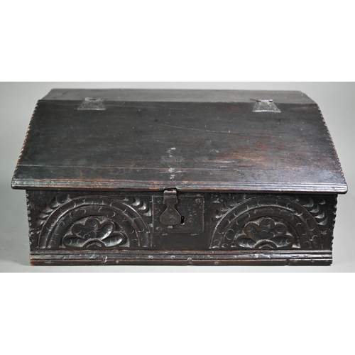 966 - A 17th century oak bible box, the iron hinged slope enclosing three drawers over a storage well, the... 