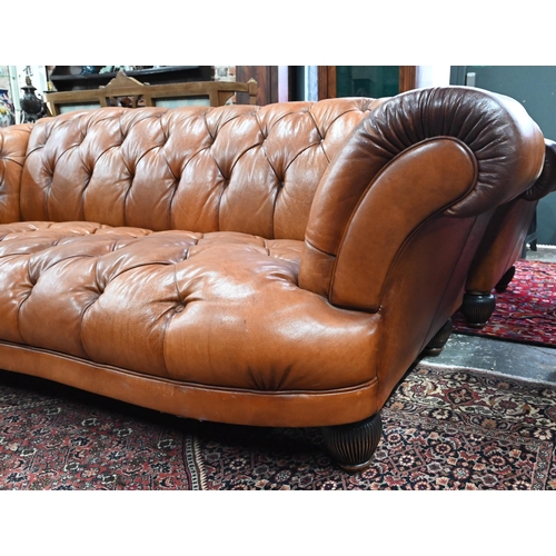 967 - A large contemporary antiqued buttoned brown leather Chesterfield style sofa and matching armchair, ... 