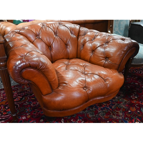 967 - A large contemporary antiqued buttoned brown leather Chesterfield style sofa and matching armchair, ... 