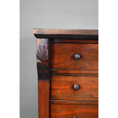 972 - A Victorian rosewood seven drawer Wellington chest, each with twin turned knobs, raised on a plinth ... 