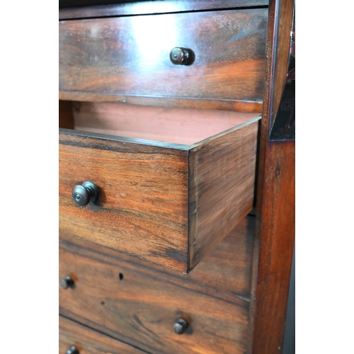 972 - A Victorian rosewood seven drawer Wellington chest, each with twin turned knobs, raised on a plinth ... 