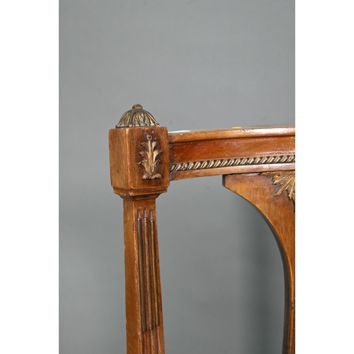 973 - An Edwardian walnut framed salon sofa, the back centred by a lyre splat flanked by fabric backrests,... 