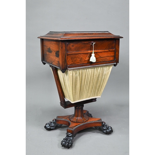 976 - A Regency rosewood work table, the hinged top enclosing a multi-division interior over a drawer and ... 