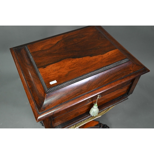 976 - A Regency rosewood work table, the hinged top enclosing a multi-division interior over a drawer and ... 