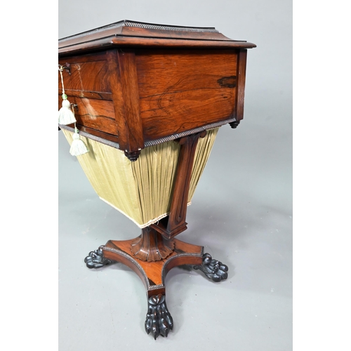 976 - A Regency rosewood work table, the hinged top enclosing a multi-division interior over a drawer and ... 