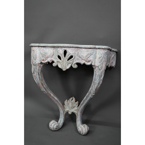 981 - An antique distress painted serpentine form console table, carved pine, raised on twin scroll legs u... 