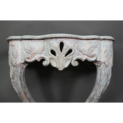 981 - An antique distress painted serpentine form console table, carved pine, raised on twin scroll legs u... 