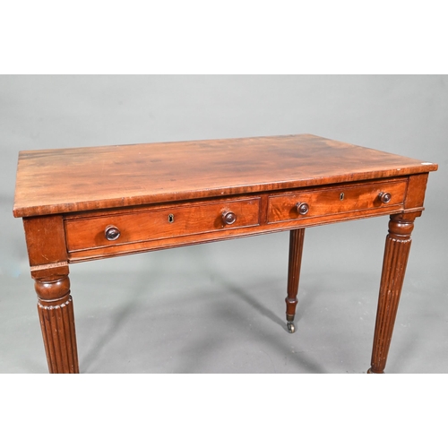 983 - A Victorian mahogany two drawer side table, raised on turned reeded legs to brass castors, 91 cm w x... 