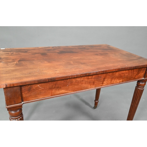 983 - A Victorian mahogany two drawer side table, raised on turned reeded legs to brass castors, 91 cm w x... 