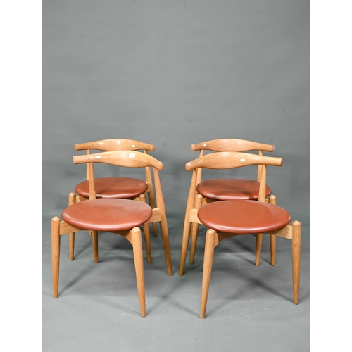 984 - Carl Hansen & Son, a contemporary set of four CH20 dining chairs, oak framed with leather seats,... 