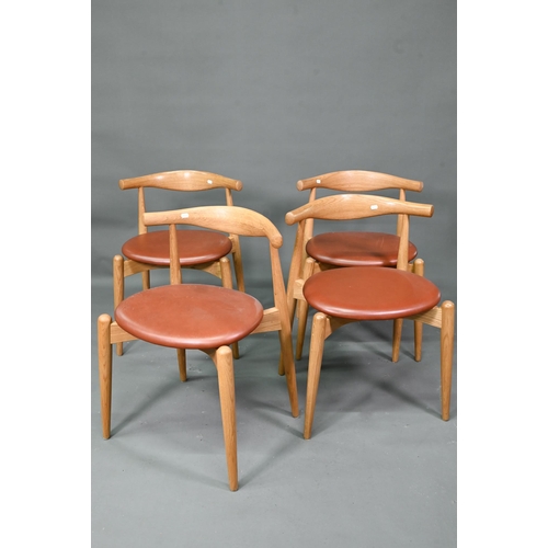 984 - Carl Hansen & Son, a contemporary set of four CH20 dining chairs, oak framed with leather seats,... 