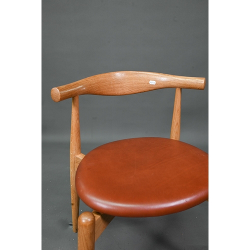 984 - Carl Hansen & Son, a contemporary set of four CH20 dining chairs, oak framed with leather seats,... 