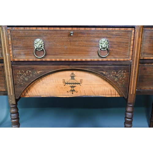 985 - A late 19th century Sheraton design mahogany breakfront sideboard, with an arrangement of six drawer... 