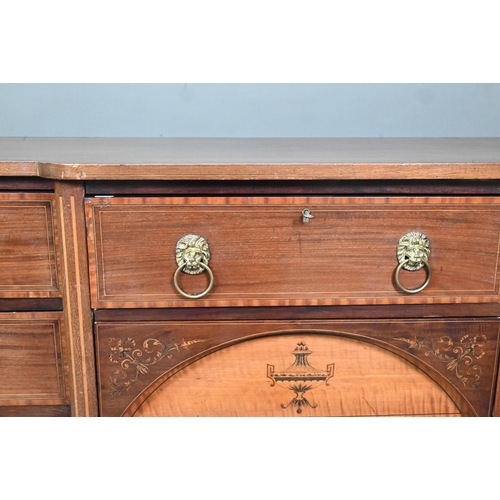 985 - A late 19th century Sheraton design mahogany breakfront sideboard, with an arrangement of six drawer... 