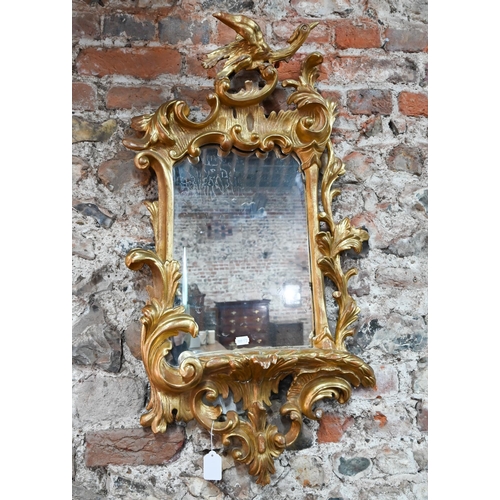 987 - A giltwood and composite Ho-ho surmounted Chippendale style mirror, 90 cm h x 48 cm w