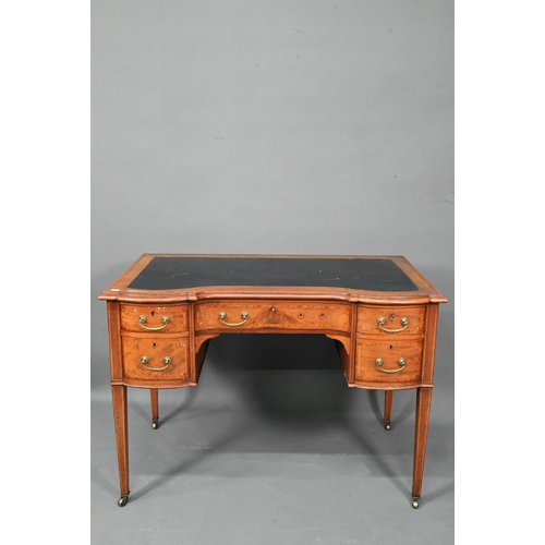 994 - A late 19th century cross-banded satinwood desk, the top with leather surface over five drawers, rai... 