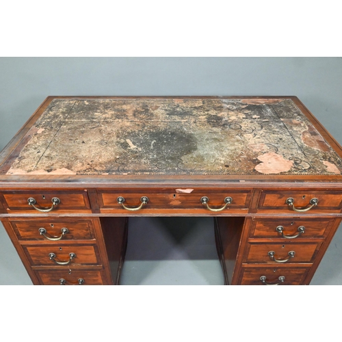 997 - Maple & Co. Ltd. a Victorian mahogany twin pedestal desk, the battered leather top over nine dra... 