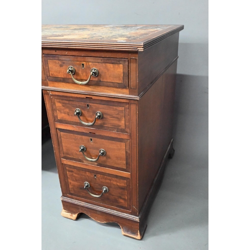 997 - Maple & Co. Ltd. a Victorian mahogany twin pedestal desk, the battered leather top over nine dra... 